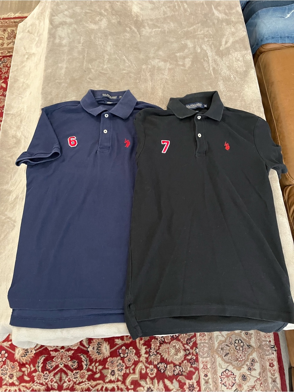 Kids U.S. Polo Assn. Twin Pack Polo Shirts in Navy and Black. Six and seven